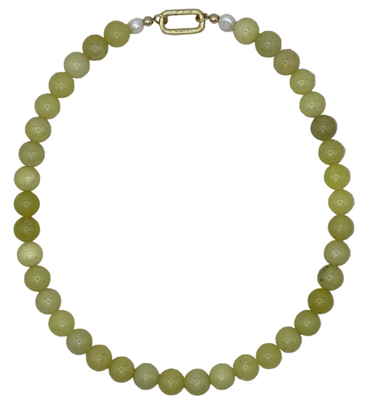 Necklace with green beads on a white background