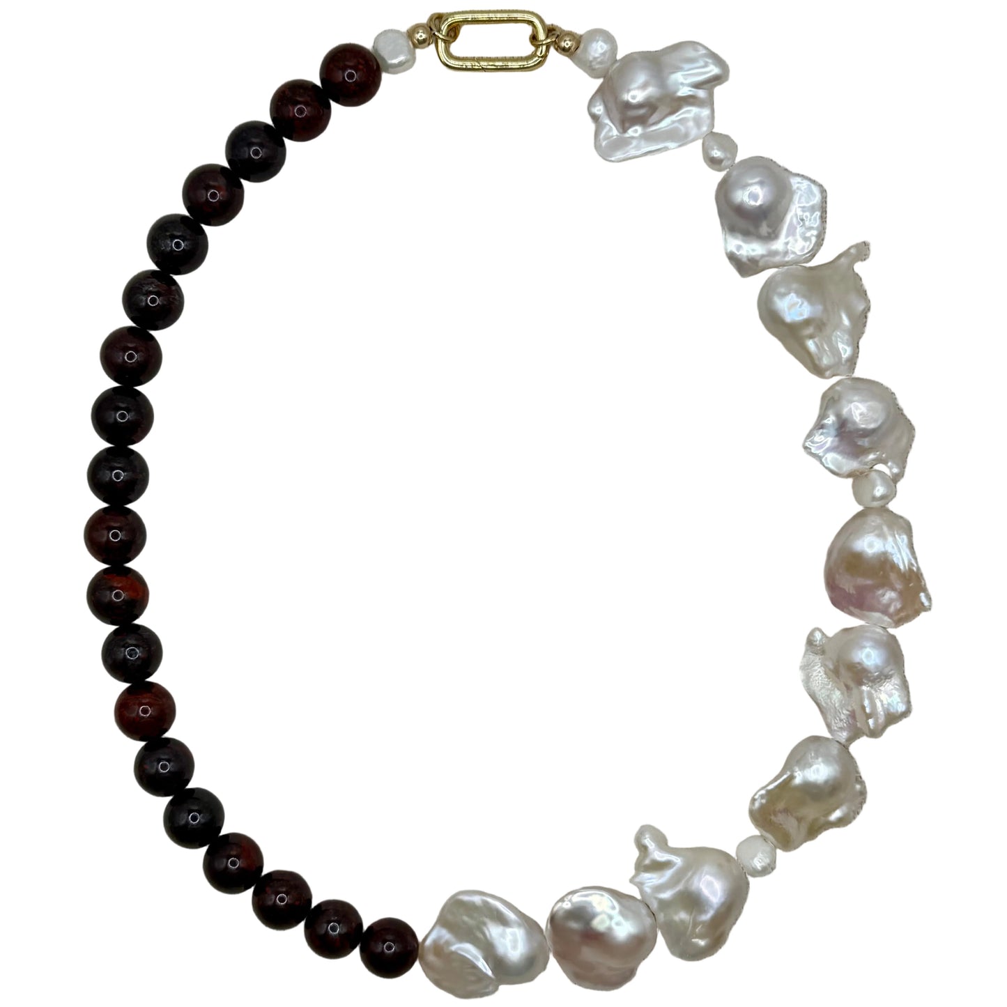 Necklace with black beads and white baroque pearls on a white background