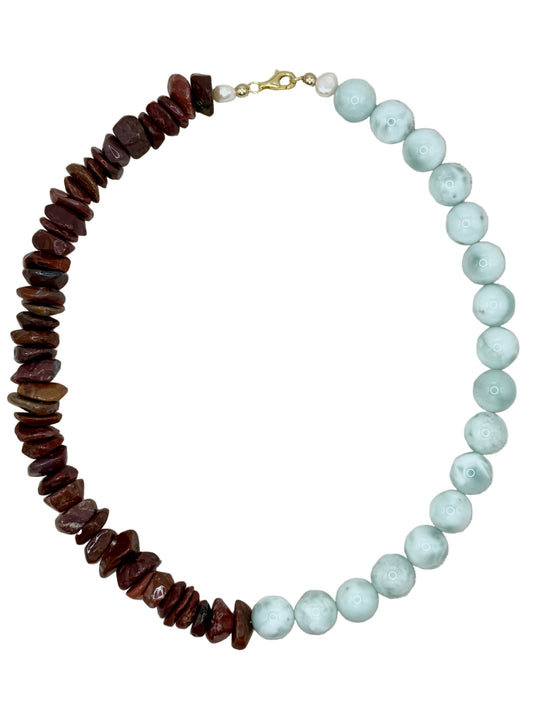 Necklace with brown and light blue beads on a white background