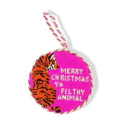 Decorative ornament with tiger design and text on a pink background