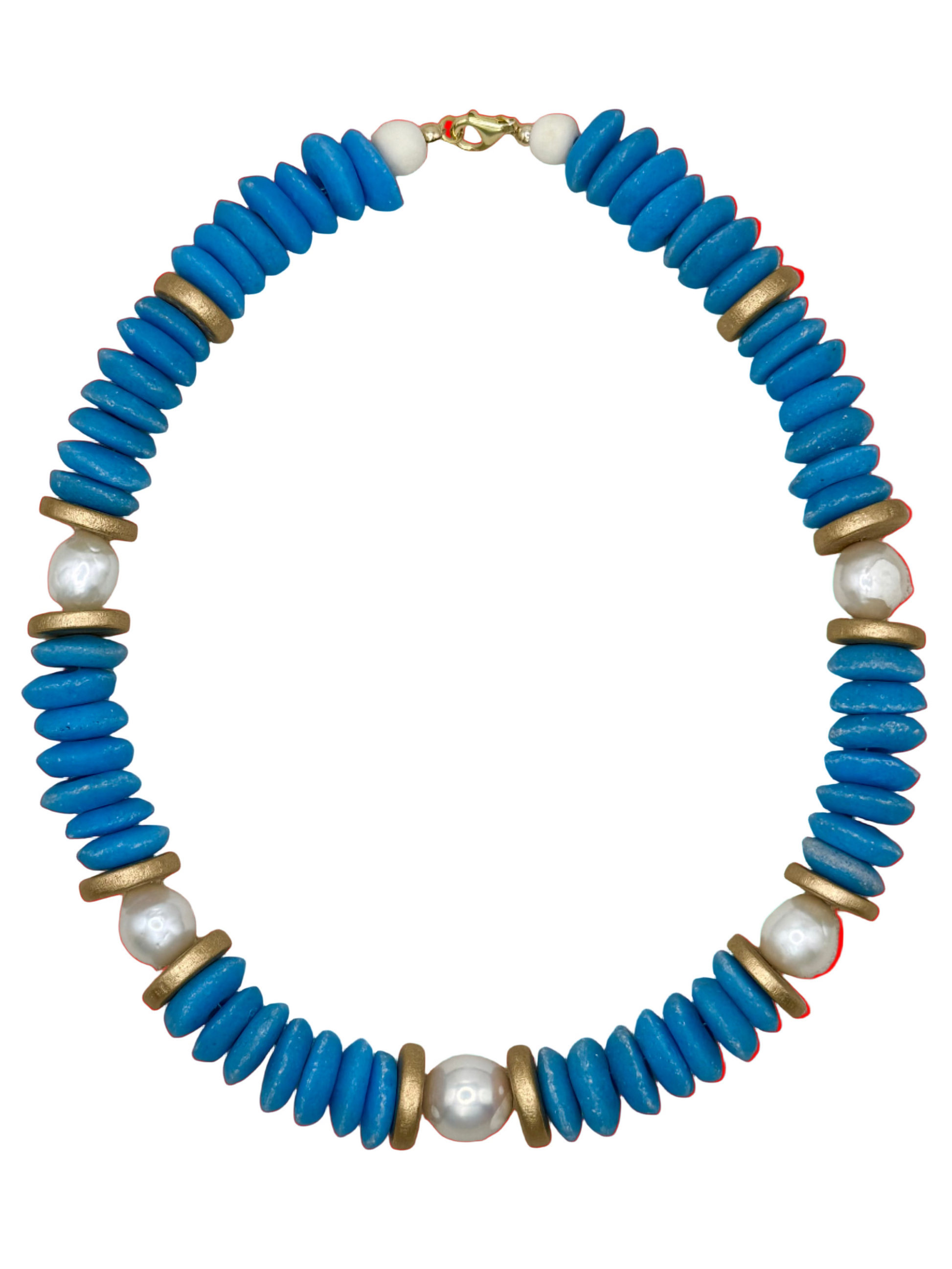 Necklace with blue beads, gold accents, and pearls on a beige fabric background