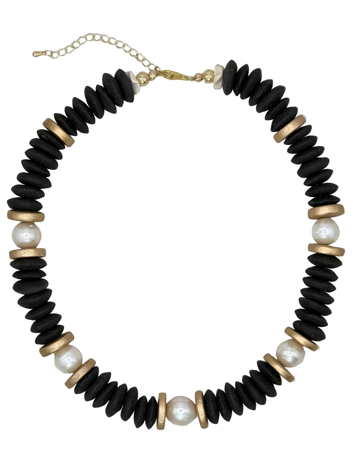 Necklace with black beads, gold accents, and pearls on a white background