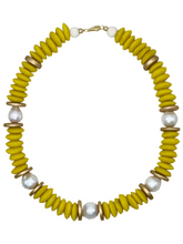 Load image into Gallery viewer, Necklace with yellow, gold, and pearl beads on a light fabric background