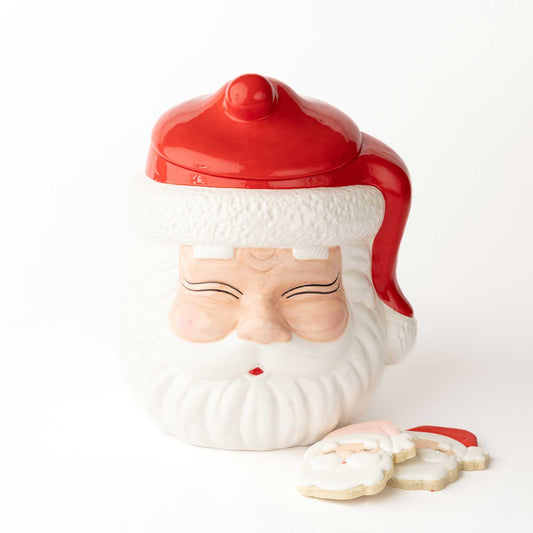 Cookie jar shaped like a Santa Claus face with a red hat on a white background