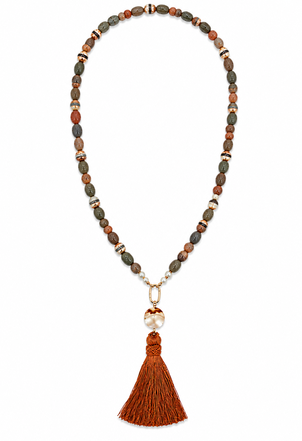 A beaded necklace featuring earthy brown, green, and terracotta beads, accented with small metallic gold and silver spacers. The necklace culminates in a gold clasp holding a white pearl and a long, rust-brown tassel, presented on a clean white background.