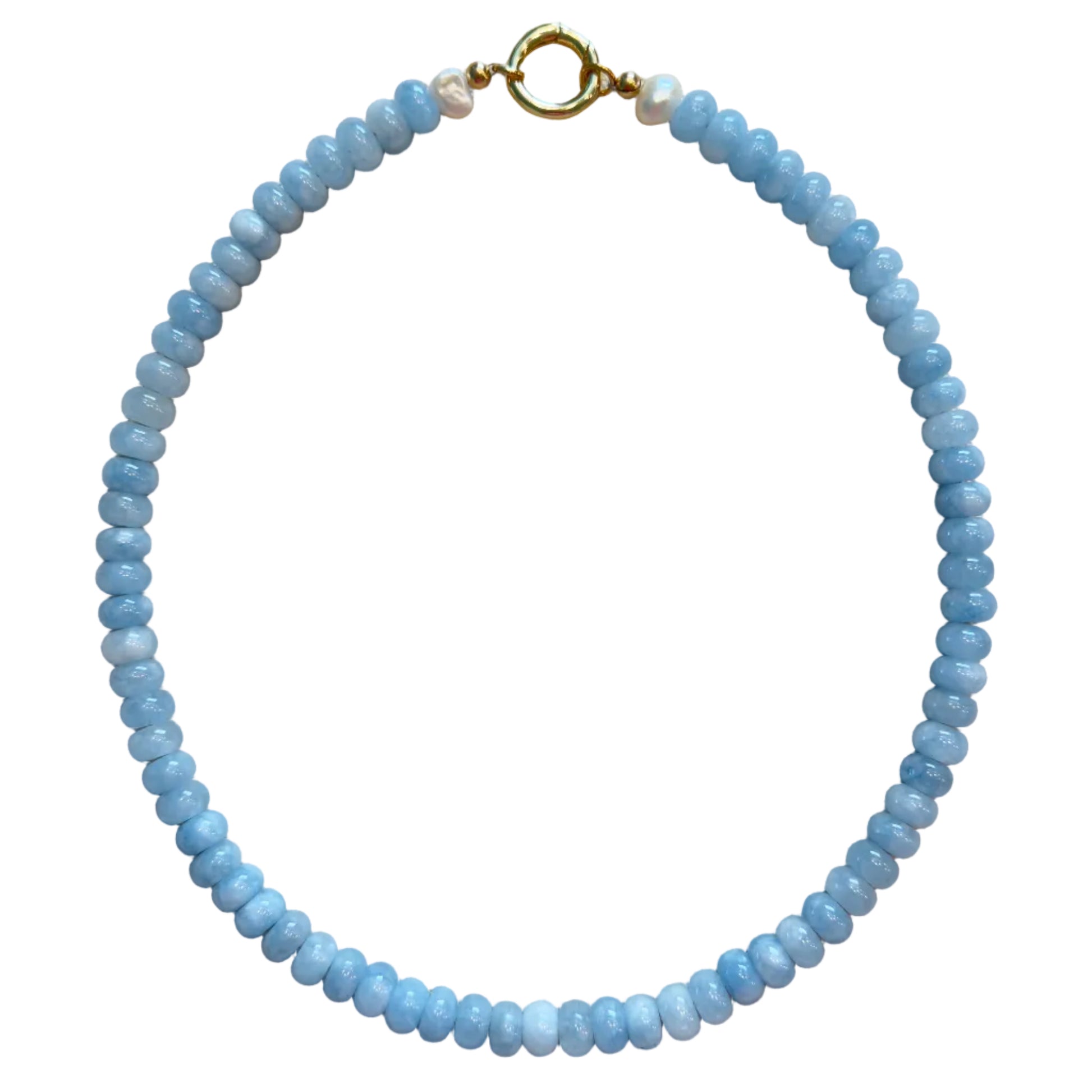 Blue beaded necklace with a gold clasp on a beige fabric background